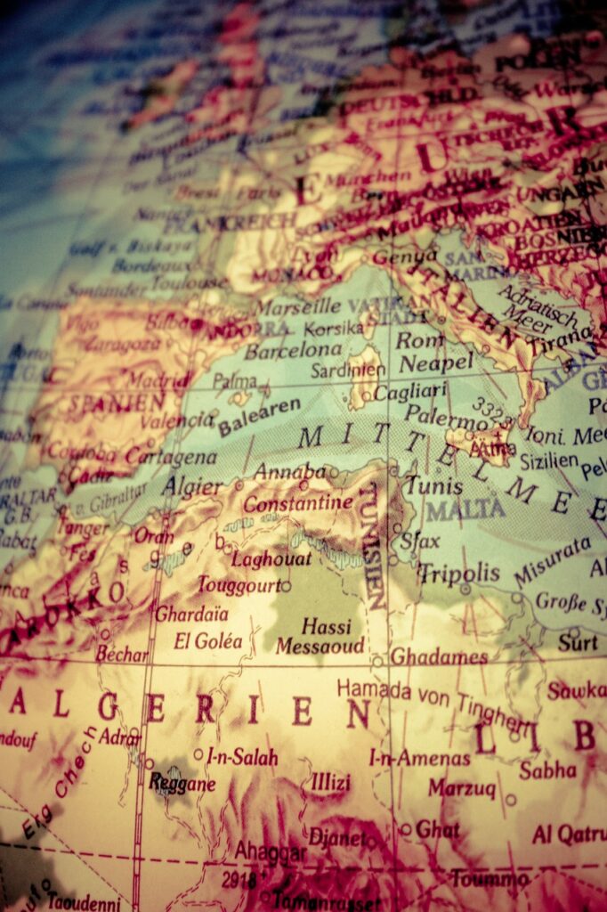 Close-up photograph of a detailed map showing the Mediterranean region, including parts of Europe, North Africa, and the Middle East, with city names and geographical boundaries clearly visible.